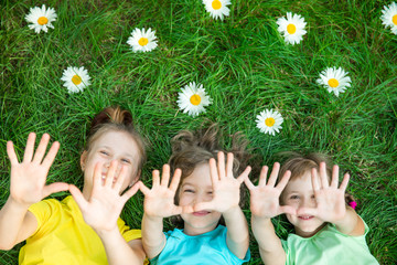 Group of happy children playing outdoors