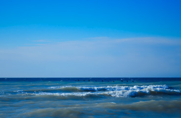 Waves rolled on the rocky coast