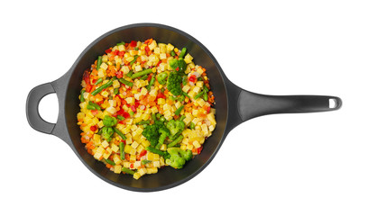 Vegetables in pan on white