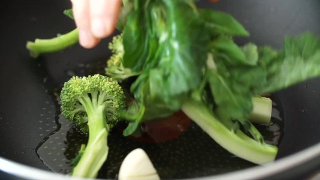 cooking sprouting broccoli, close up slow motion 200 fps 