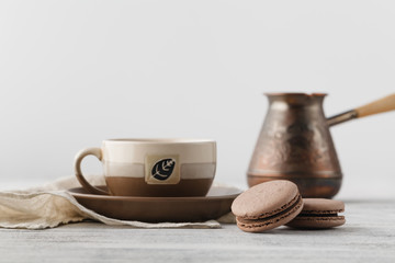 Breakfast at workplace. Coffee and chocolate macaroons
