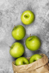 Ripe green apples on a light background. Top view. Food backgrou