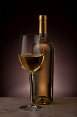 White wine glass and bottle