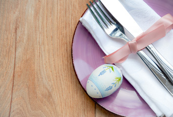 Easter table setting on wood background