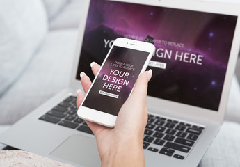 Close View of User with Laptop and Smartphone Mockup