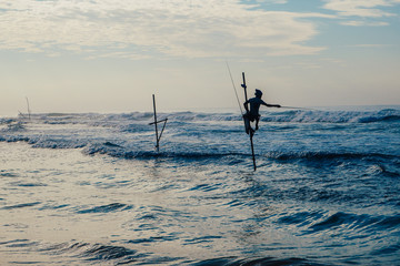 Local fisherman on stick on a beach of Indian ocean, Sri Lanka