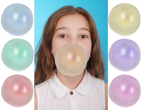 Girl blowing a big bubble gum bubble