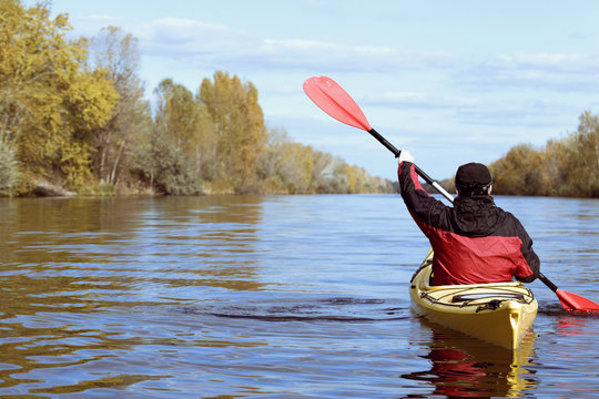 Traveling by kayak on the river on a sunny day.