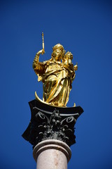 Fototapeta premium Munich, Germany, Bavaria - gilded Mary statue with Christ as a child