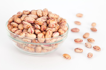 Colorful kidney beans in wooden bowl on white background. Vegan vegetarian healthy food.