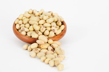 Green kidney beans in wooden bowl on white background. Vegan vegetarian healthy food.
