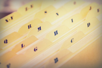 Close up of alphabetical index cards in box