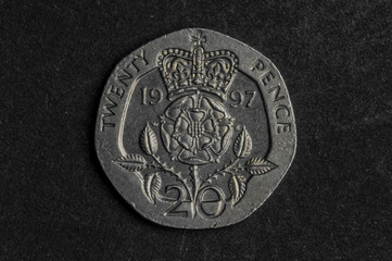 Close up of  twenty pence coin on black background - business concept