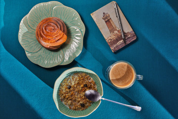 Light breakfast and cozy notebook with a lighthouse print