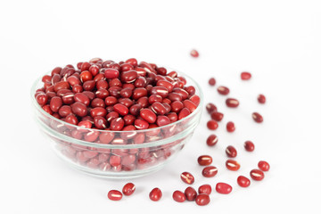 Red azuki  beans in glass bowl on white background. Vegan vegetarian healthy food.