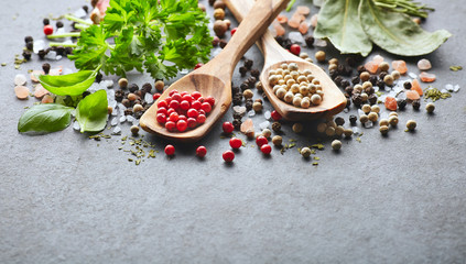 Spices and herbs on a graphite board