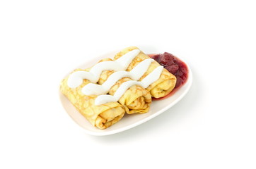 pancakes on plate with sour cream and jam, white background