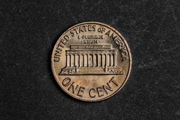 Close up of one american cent on black background - business concept