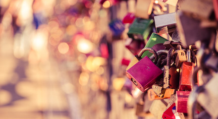 Colorful padlocks, symbol of love and devotion on the bridge