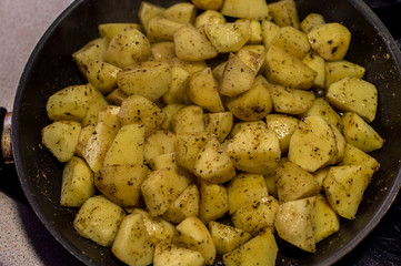 Cooking fried potatoes with spicies