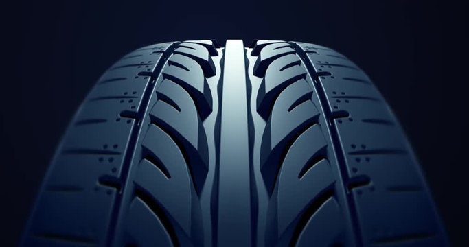 Close up car tire in slow motion with depth of field