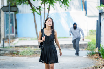 criminal hand holding shot gun woman on street,rop concept