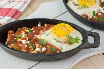 Shirred eggs with marinara and feta.