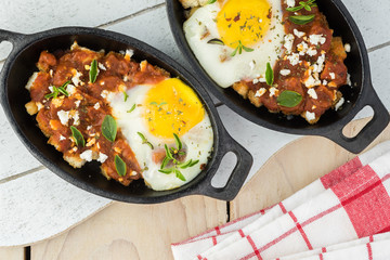 Shirred eggs with marinara and feta.
