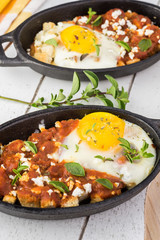 Shirred eggs with marinara and feta.