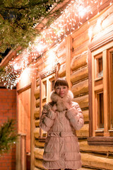 young woman snow winter bokeh magic light logs