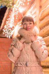 young woman snow winter bokeh magic light logs
