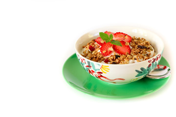 Healthy breakfast granola, strawberry and yogurt isolated on white background.