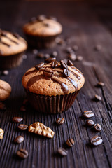 Coffee muffins with grated walnut and topped with chocolate