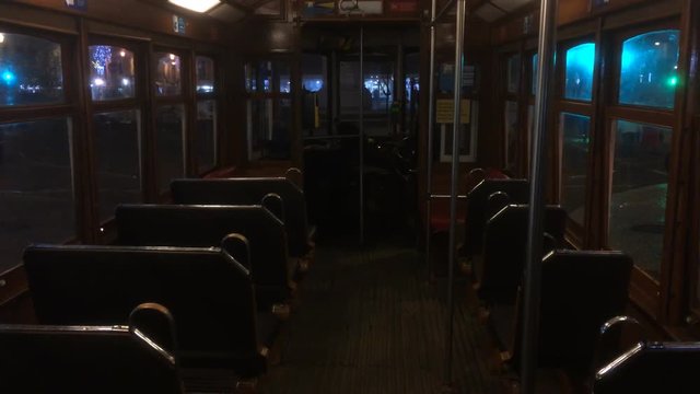 Inside Famous Cable Car In Lisbon at Night: The Lisbon tramway network serves the municipality of Lisbon, capital city of Portugal. In operation since 1873.