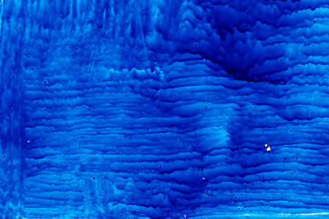 blue paint on glass backgrounds