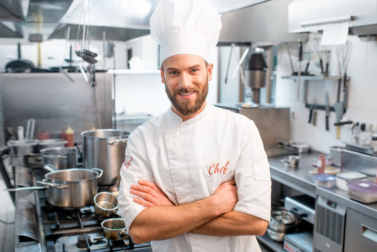 Portrait of chef cook on the restaurant kitchen