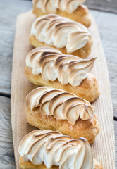 Eclairs with lemon curd and meringue