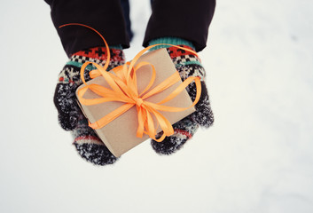 gift in hands in winter