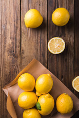 Lemons  on a wooden background. Lemons. Fruits. Lemon halves. Mint. Healthy food concept. Copyspace