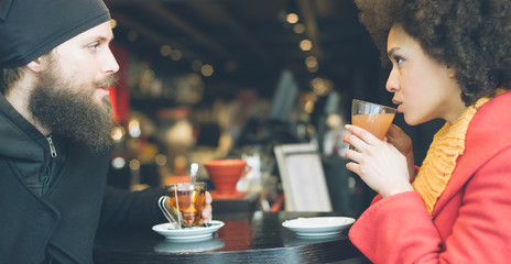Beautiful couple enjoying tea in a restaurant