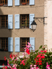 Fototapeta na wymiar Typical French Windows, flowers and Lantern at Sisteron, Provenc