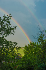 Beautiful spring rainbow after the rain in the country