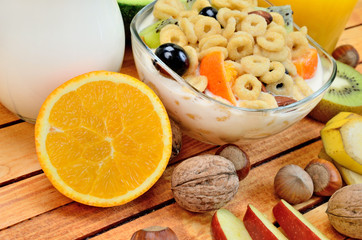cereal with milk and fruit on table