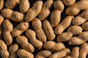 Peanuts seed. Many groundnuts. Background of raw peanuts in shell.