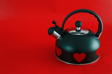 Stovetop whistling kettle with red hearts. Happy Valentines Day	