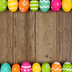 Colorful Easter egg double border against a rustic wood background