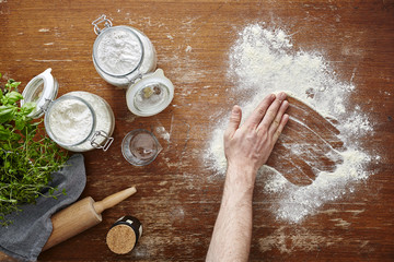 hand wiping flour in baking scene