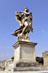 Fototapeta na wymiar St. Angelo Bridge Angel with the Superscription sculpture