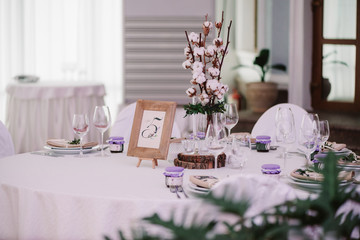 Guest table, with bouquet from cotton and frame with number