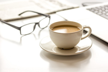 Office breakfast with laptop on white desk